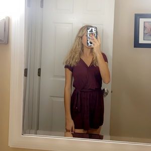 a dark red romper